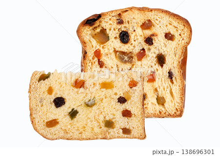 Traditional Christmas panettone sliced and filled with candied fruit and raisins, set on a white background. A classic sweet bread from Italian cuisine Traditional Christmas panettone sliced and filled with candied fruit and raisins, set on a white background. A classic sweet bread from Italian cuisine 138696301