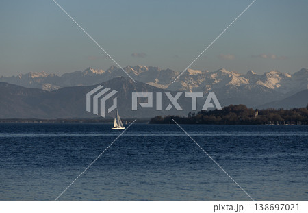 Sailboat on Starnberg Lake with snowcapped Alps in Bavaria Sailboat on Starnberg Lake with snowcapped Alps in Bavaria 138697021
