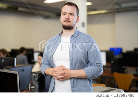 Guy in computer design and information technology classroom 138698480
