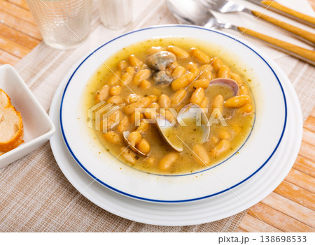 Alubias con almejas of white beans stewed with clams 138698533