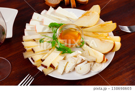 Cheese plate with pears and honey Cheese plate with pears and honey 138698603