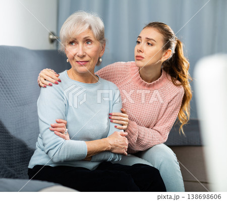 Woman apologising to her smiling mother Woman apologising to her smiling mother 138698606