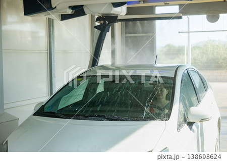 Process of car washing with driver inside 138698624