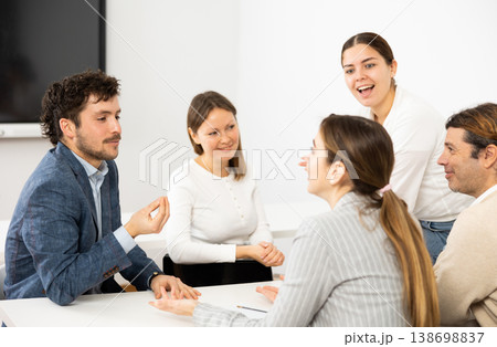 Male and female students learning course subject together Male and female students learning course subject together 138698837