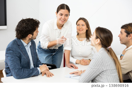 Male and female students preparing for exam together in university Male and female students preparing for exam together in university 138698916