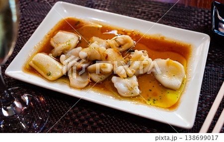 Tasty dish of japanese cuisine fried sepia in sauce Tasty dish of japanese cuisine fried sepia in sauce 138699017