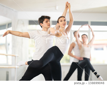 Young guy and young woman rehearsing pair ballet 138699048