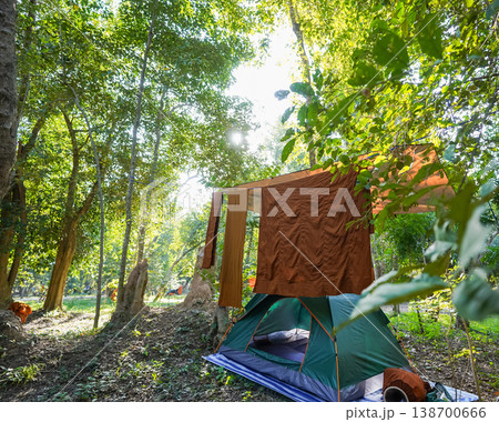 Forest tents, hanging robes and shaded paths create a clear retreat backdrop. The natural scene suits meditation and religion content. Forest tents, hanging robes and shaded paths create a clear retreat backdrop. The natural scene suits meditation and religion content. 138700666
