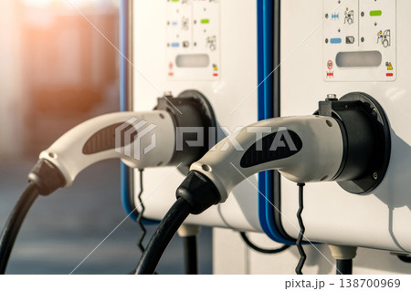 Electric car charging station for charge EV battery. Plug for vehicle with electric and hybrid engine. EV charger. Clean energy. Charging point for EV car. Green power. Future transport technology. 138700969