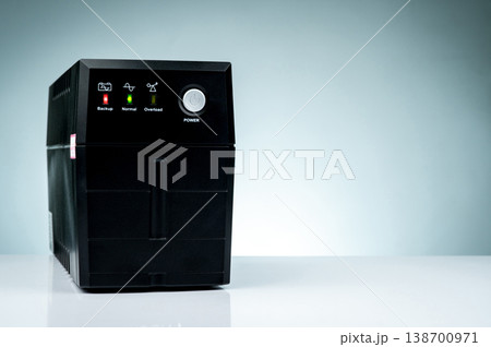 Uninterruptible power supply isolated on white background. Backup Power UPS with battery. UPS with stabilizer for home PC. Equipment for computer system at office for security. Power protection. Uninterruptible power supply isolated on white background. Backup Power UPS with battery. UPS with stabilizer for home PC. Equipment for computer system at office for security. Power protection. 138700971