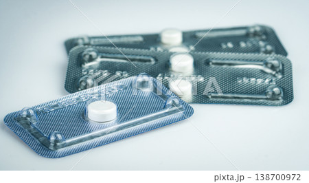 Emergency contraceptive pills in blister pack on blurred background of morning after pills. Drug cause of ectopic pregnancy. Emergency contraception for prevent pregnancy. World Contraception Day. 138700972