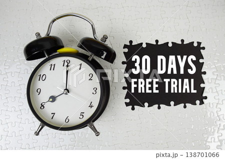 30 Days Free Trial text with alarm clock on black background 30 Days Free Trial text with alarm clock on black background 138701066