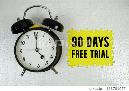 90 Days Free Trial text with alarm clock on yellow background 90 Days Free Trial text with alarm clock on yellow background 138701075