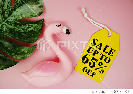 Price tag Sale 65% with summer decorations on pink background 138701108