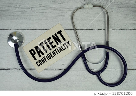 Patient Confidentiality text with Medical Stethoscope on wooden background 138701200