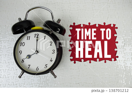 Time To Heal text with alarm clock on red background 138701212