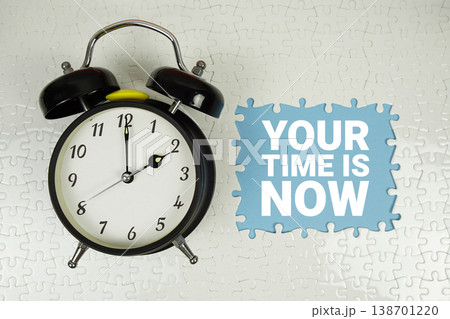 Your Time Is Now text with alarm clock on blue background 138701220
