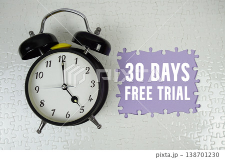 30 Days Free Trial text with alarm clock on purple background 138701230