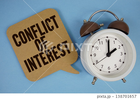 Conflict Of Interest text with alarm clock on blue background 138701657