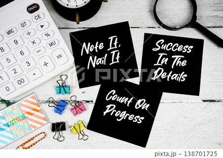 Note It, Nail It, Success In The Details, Count On Progress text written on paper note with calculator and magnifying glass on wooden background Note It, Nail It, Success In The Details, Count On Progress text written on paper note with calculator and magnifying glass on wooden background 138701725