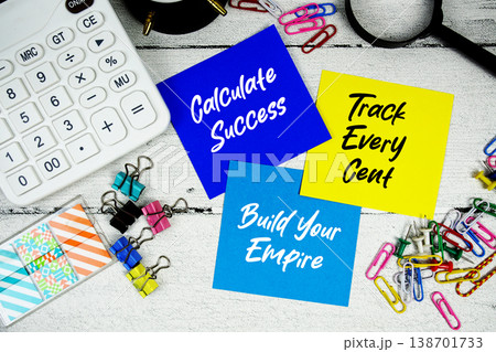 Calculate Success, Track Every Cent, Build Your Empire text written on paper note with calculator and magnifying glass on wooden background Calculate Success, Track Every Cent, Build Your Empire text written on paper note with calculator and magnifying glass on wooden background 138701733