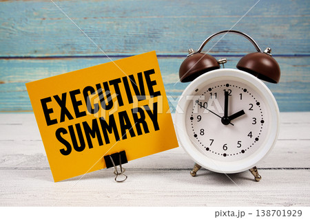 Executive Summary text written on paper card with alarm clock on wooden background 138701929