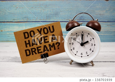 Do You Have A Dream? text written on paper card with alarm clock on wooden background 138701939