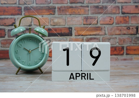 Wooden Calendar Showing the Date of April 19th. Day 19 of April month Wooden Calendar Showing the Date of April 19th. Day 19 of April month 138701998