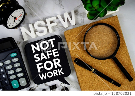 NSFW - Not Safe For Work acronym with calculator, alarm clock and magnifying glass, Business concept background NSFW - Not Safe For Work acronym with calculator, alarm clock and magnifying glass, Business concept background 138702021