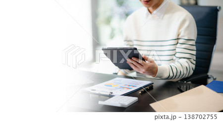 Businessmen analyzing investment graph and discussing plan new start up project. Businessmen analyzing investment graph and discussing plan new start up project. 138702755