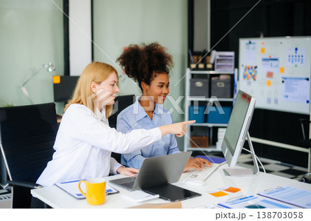 Female discussing new project with male colleague. Young woman talking Female discussing new project with male colleague. Young woman talking 138703058
