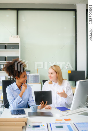 Female discussing new project with male colleague. Young woman talking Female discussing new project with male colleague. Young woman talking 138703061
