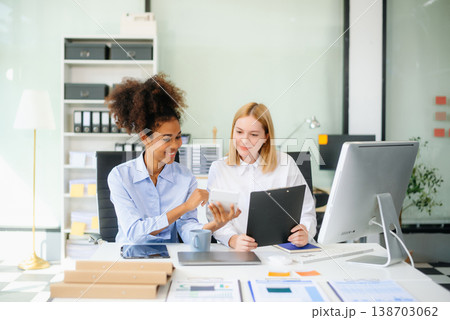 Female discussing new project with male colleague. Young woman talking Female discussing new project with male colleague. Young woman talking 138703062