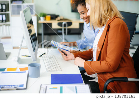Female discussing new project with male colleague. Young woman talking Female discussing new project with male colleague. Young woman talking 138703163