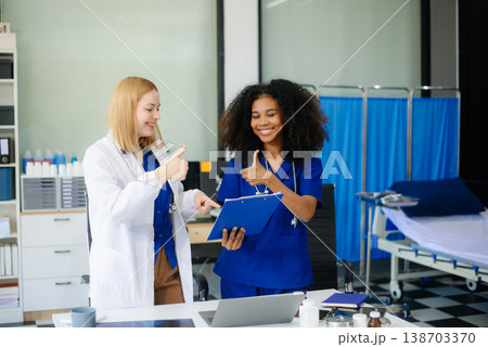 Medical, meeting and doctors with laptop for research, planning and hospital schedule management. 138703370