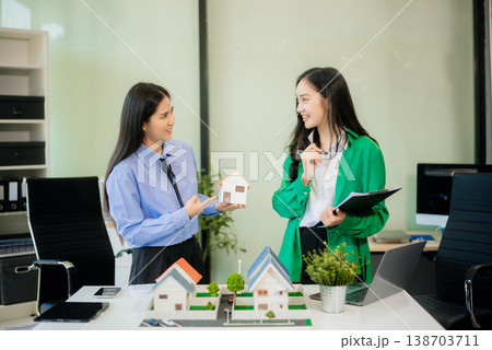 Signing a contract. Client and broker agent, lease agreement, successful deal and Young business sitting Signing a contract. Client and broker agent, lease agreement, successful deal and Young business sitting 138703711