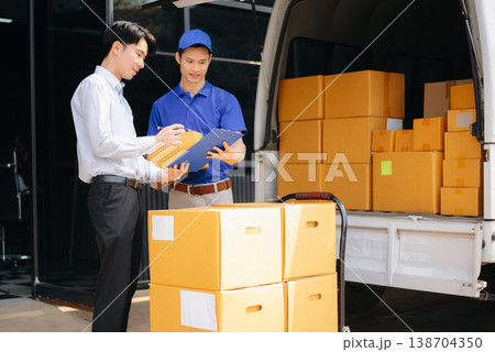 Asian Courier Delivering Package to man Delivery service near van outside the warehouse, delivery home Asian Courier Delivering Package to man Delivery service near van outside the warehouse, delivery home 138704350