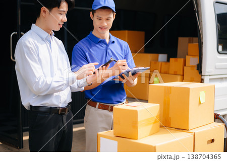 Asian Courier Delivering Package to man Delivery service near van outside the warehouse, delivery home Asian Courier Delivering Package to man Delivery service near van outside the warehouse, delivery home 138704365