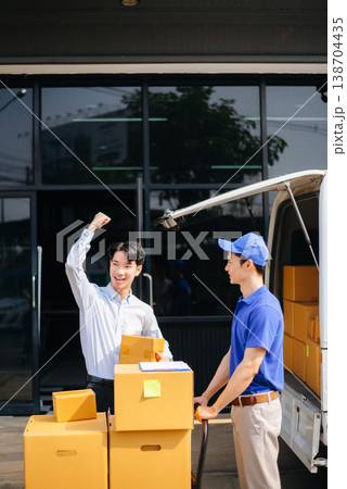 Delivery Asian man by sending box of parcel to customers service at home Delivery Asian man by sending box of parcel to customers service at home 138704435