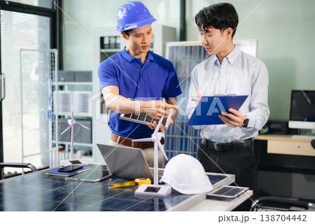 Engineer Team Meeting of Sustainable on a solar and wind energy project, discussing innovation 138704442