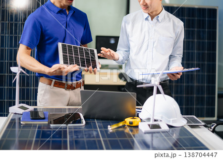 Engineer Team Meeting of Sustainable on a solar and wind energy project, discussing innovation 138704447