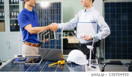 Engineer Team Meeting of Sustainable on a solar and wind energy project, discussing innovation 138704450