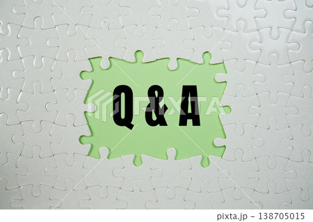 Jigsaw puzzle with a missing piece with "Q&A" on green background Jigsaw puzzle with a missing piece with "Q&A" on green background 138705015