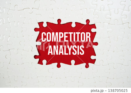 Jigsaw puzzle with a missing piece with "Competitor Analysis" on red background 138705025