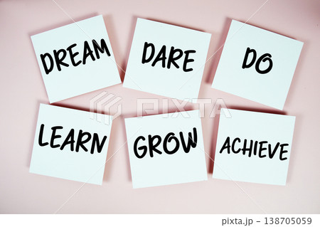 Dream, Dare, Do, Learn, Grow, Achieve message written on paper notes Motivation concept 138705059