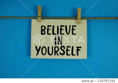 Believe in Yourself text written on paper card with rope and wooden clip hanging 138705148