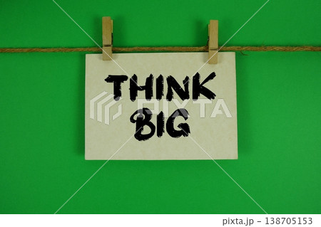 Think Big text written on paper card with rope and wooden clip hanging Think Big text written on paper card with rope and wooden clip hanging 138705153