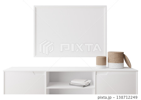 This setup features a white sideboard with storage spaces and a minimalist picture frame above. There are decorative items on the sideboard and books nearby 138712249