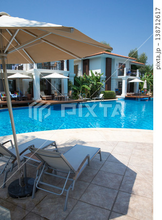 Swimming pool. Summer vacation at poolside. swimming pool in resort hotel for vacation leisure 138712617