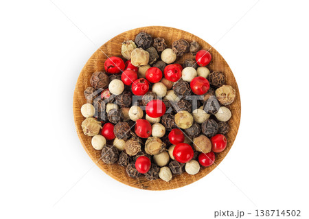 Pepper mix in a wooden bowl isolated on white background. Top view 138714502